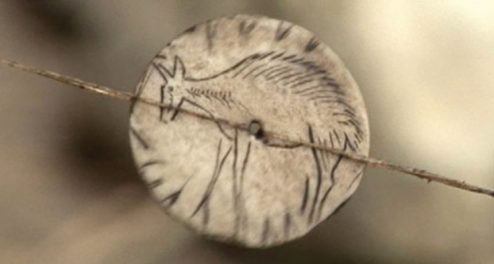 An ancient spinning disk (reconstruction shown) found in what's now southwestern France may have been a children's toy. St-Germain-en-Laye

